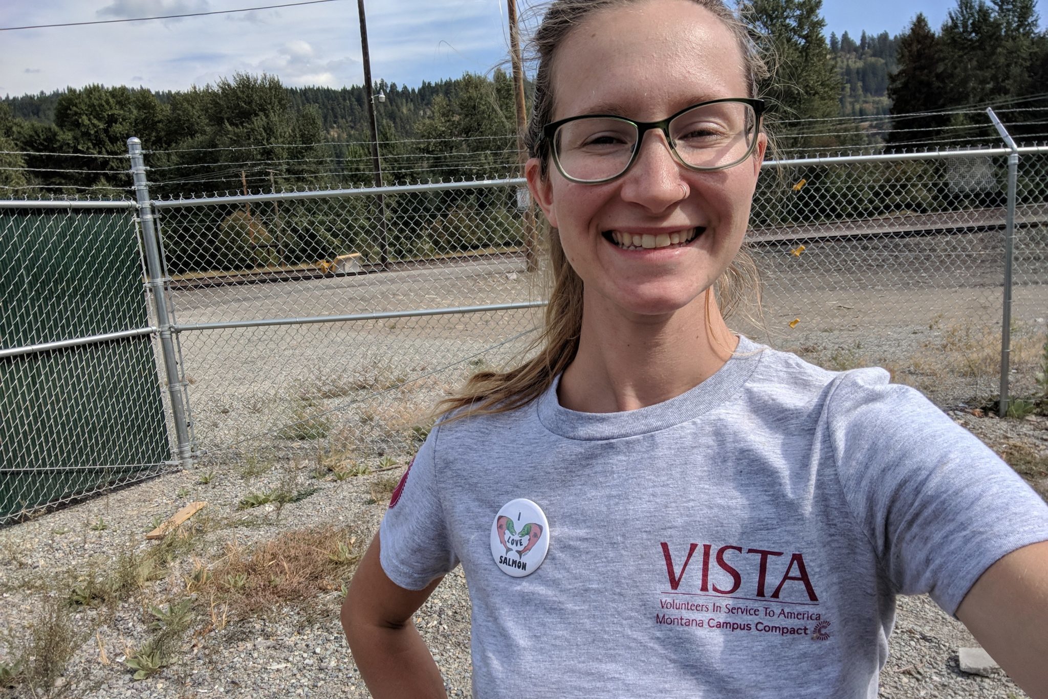 a woman smiling wearing a VISTA shirt